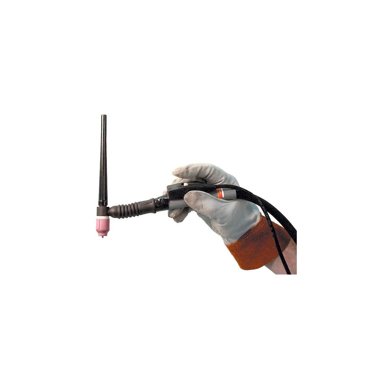 A gloved hand holds a TIG welding torch with a pink ceramic nozzle and pointed tungsten electrode while using a Lincoln Arc Start Switch K814. The person’s wrist is in a brown welding glove, with a plain white background.