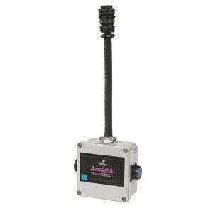 The Lincoln ARCLINK T Cable Connector K2429-1 is a small, rectangular gray device with a black ArcLink label, blue circular connectors on both sides for multiple feeders, screws at each corner, and a thick black cable on top.