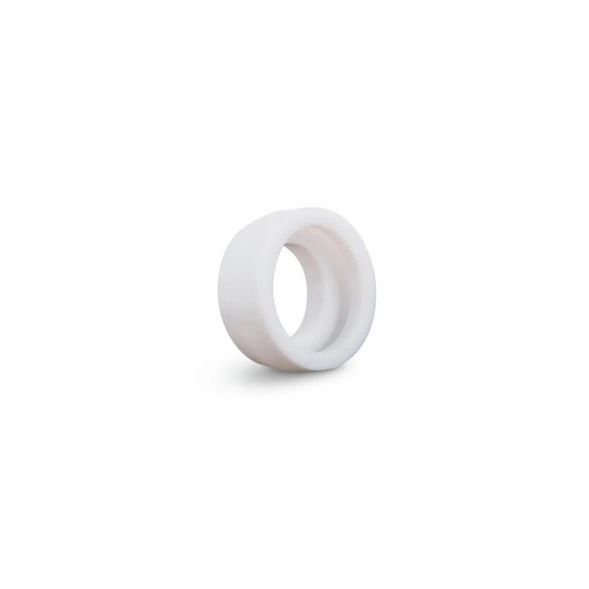A Lincoln Caliber Stubby Gas Lens Insulator for TIG Torch 17/18/26 (KP4764-GL, 2/pack) is shown tilted on a plain white background. The small, white cylindrical insulator has a smooth surface, hollow center, and casts a faint shadow to the left.