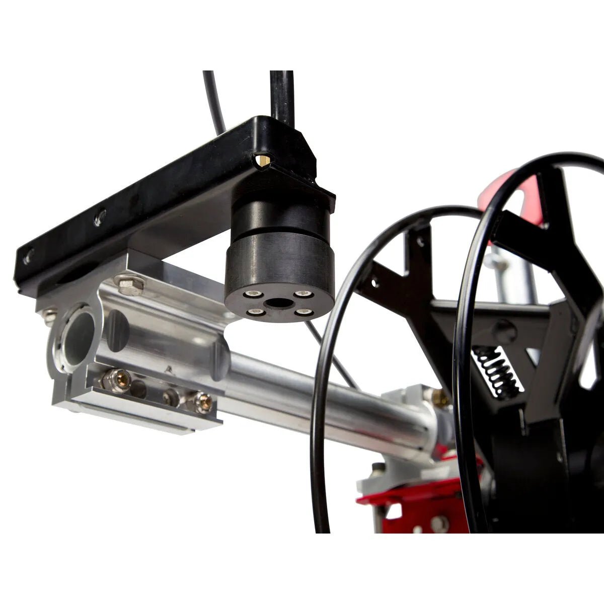 Close-up of a mechanical assembly featuring a black cylindrical sensor or tool on a metal rail, resembling components of the Lincoln Cruiser Submerged Arc Welding Tractor K3048-2, with wiring, gears, and a coiled spring against a white background.