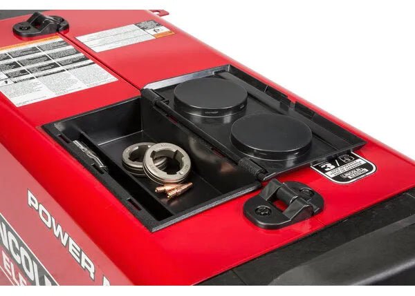 Lincoln Electric POWER MIG 260 welder demo with open storage, copper connectors, metal parts, covers—WeldingMart welding equipment.