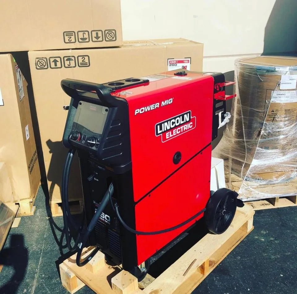 Lincoln Electric POWER MIG 260 MIG Welder U3520-1, red and black, factory demo, welding equipment on pallet at WeldingMart.