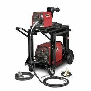 A red and black Lincoln Electric multi-process welding machine on a wheeled cart with cables, welding gun, clamp, and wire feeder LF-72, designed for industrial or workshop use.