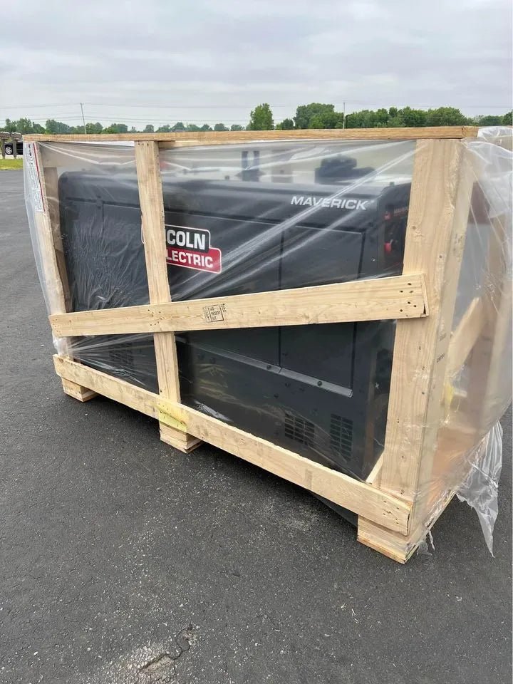 Lincoln Maverick 325X Engine Driven Welder Kubota U3581-1 in crate, wrapped in clear plastic, WeldingMart equipment outdoors.