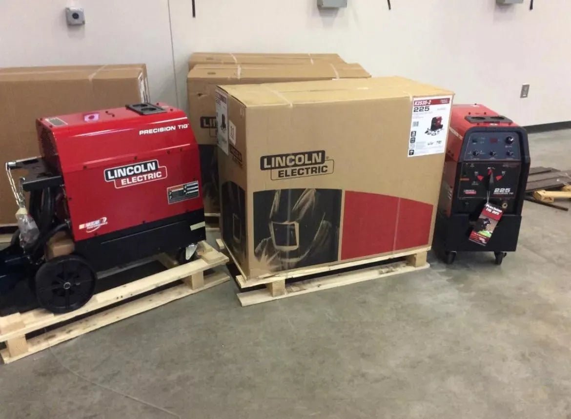 Lincoln Precision TIG 225 Welders Ready-Pak with Cart, boxed and unpacked, plus a compact TIG welder on concrete floor. WeldingMart.