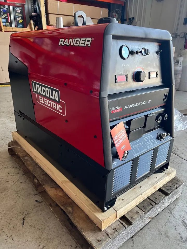 Lincoln Ranger 305G welder U1726-5, low hours, red/black, on pallet in workshop—professional welding equipment at WeldingMart.