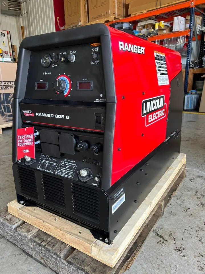 Lincoln Ranger 305G Low Hour Factory Demo welder U1726-5 on pallet in workshop, WeldingMart welding equipment and tools visible.
