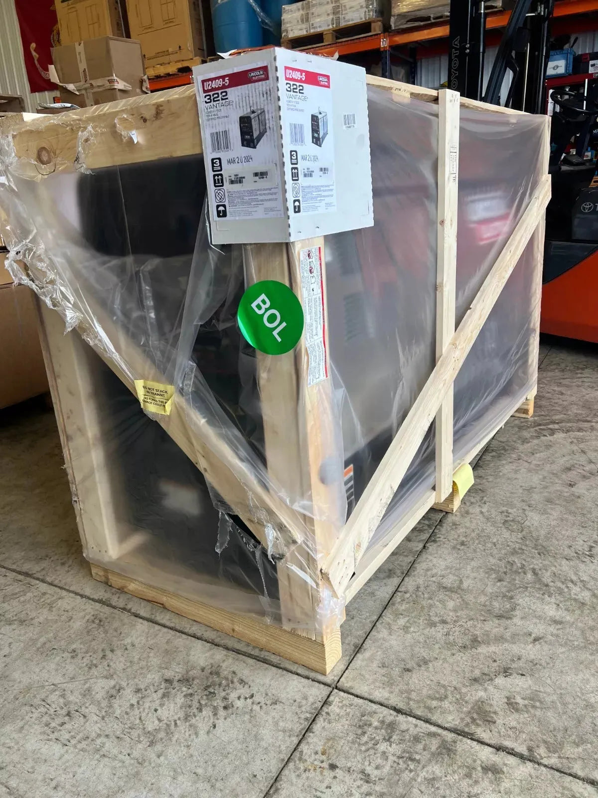 Lincoln Vantage 322 welder/generator Kubota U2409-5 crated and wrapped, with Toro box and warehouse shelving at WeldingMart.