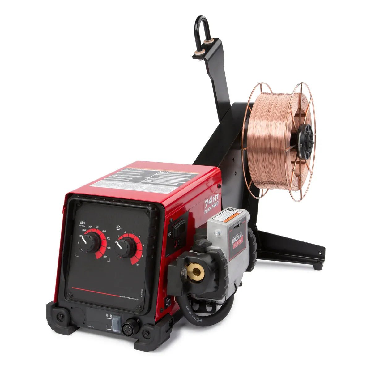 Close-up of the Lincoln Flex Feed 74 HT Simple U/I, Heavy Duty Reel K3883-11 wire feeder with front control dials and labels. A copper wire spool is mounted on a black arm at the right. The industrial machine sits on a white background.