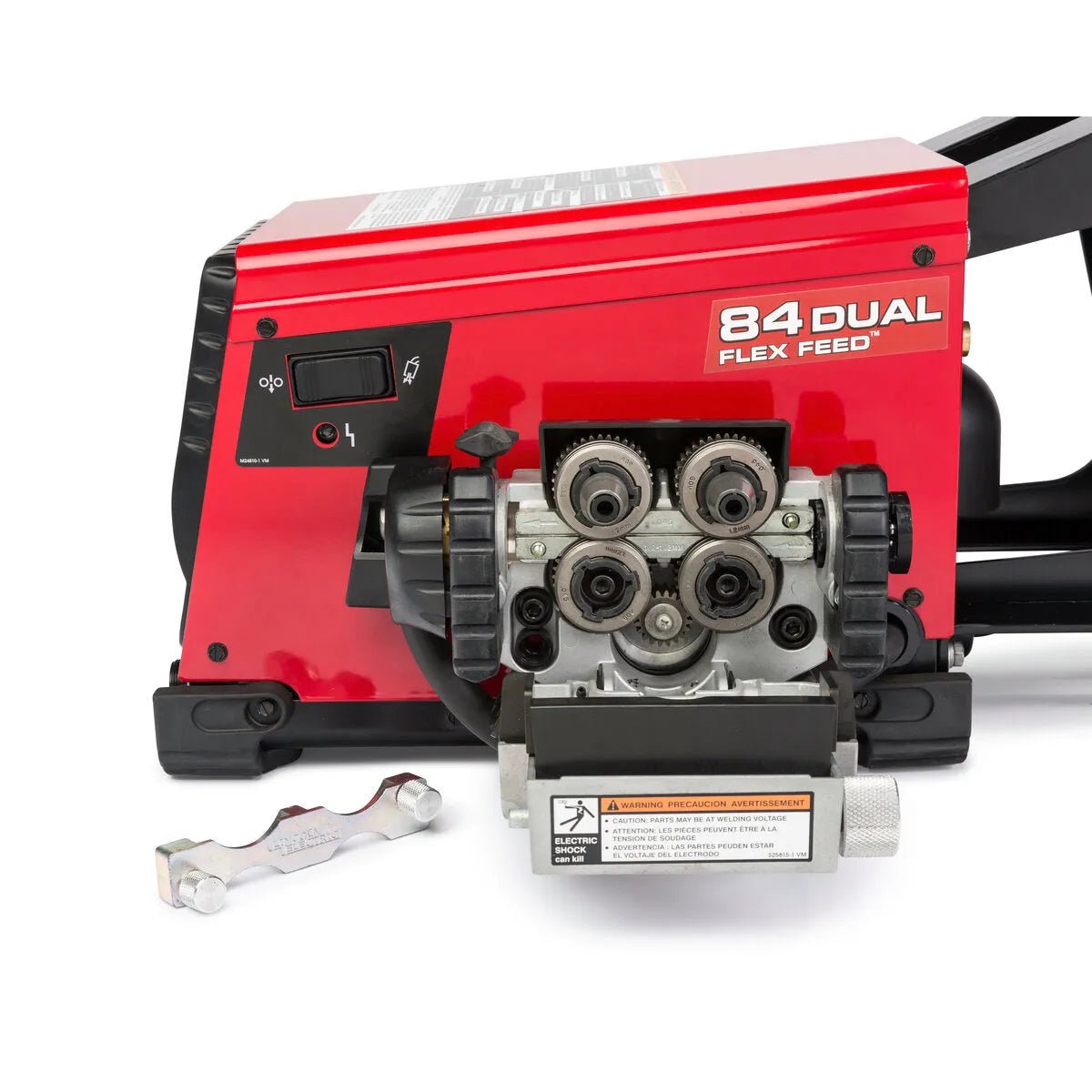 A Lincoln Flex Feed 84 Dual Bench (K5002-5) in red is shown with its front panel open, displaying four silver rollers, gears, a black display and control switch. A metal wrench and heavy duty wire reel stand are positioned in front.