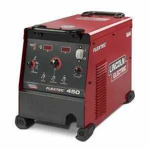 The Lincoln Flextec 450 LF72 Standard Duty One-Pak w/ Voltage Reduction Device (K2960-2) features a red design with black handles, control knobs, gauges, a labeled front panel, ventilation slats, and sturdy black feet for stability.