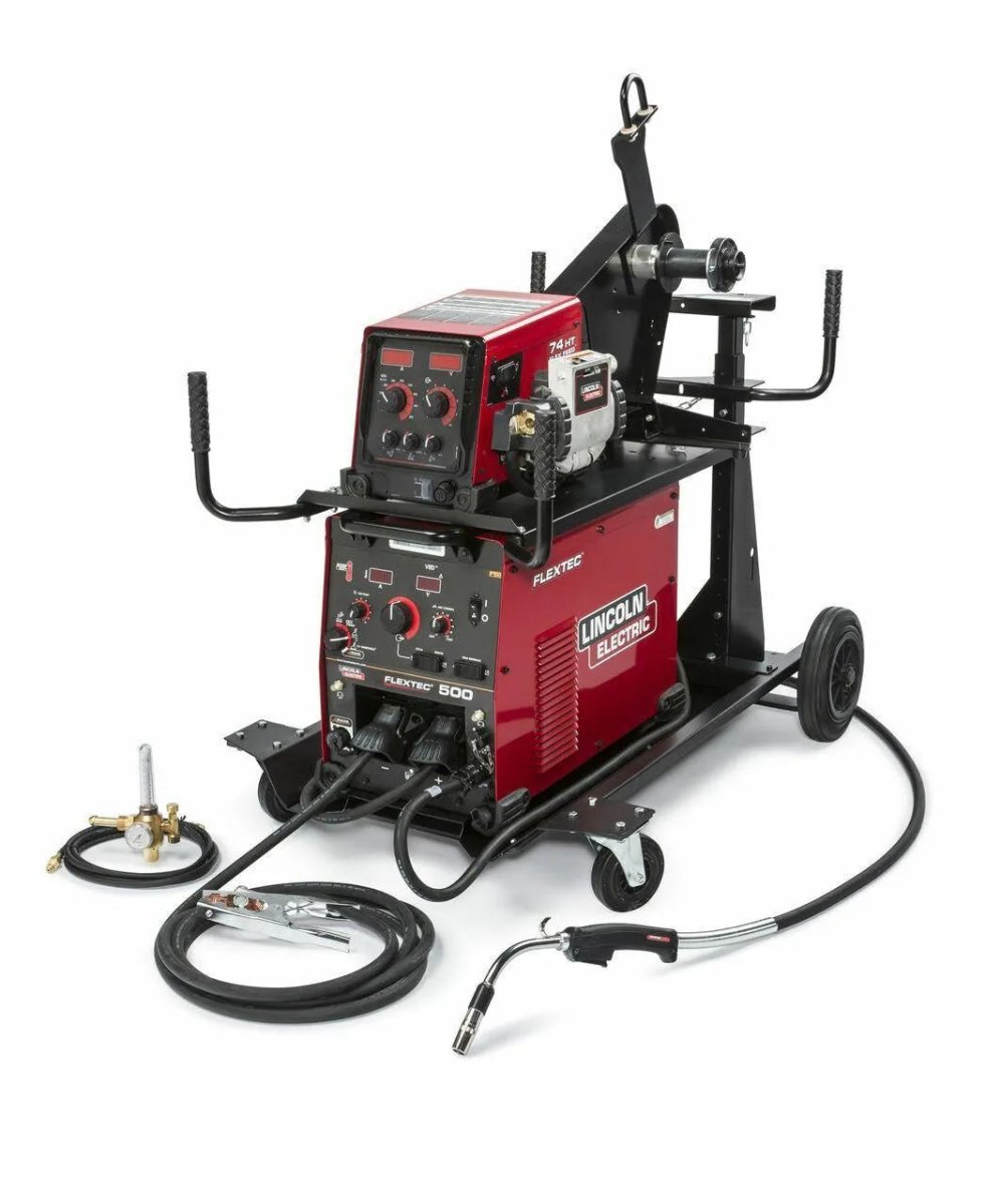 A red and black Lincoln FLEXTEC 500 Multi-Process Welder w/ FlexFeed 74HT Ready-Pak (K4093-1) on a wheeled cart, featuring control panels, cables, hoses, welding torch, ground clamp, wire feeder, and rear cylinder rack.