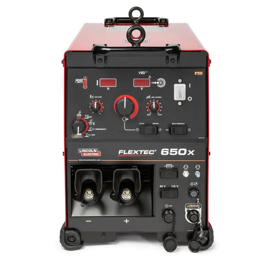 The Lincoln Flextec 650X Multi-Process Welder with CrossLinc Technology (K3425-1) has red sides, a black control panel with multiple dials, switches, and sockets for precise voltage, amperage, and welding function adjustments.