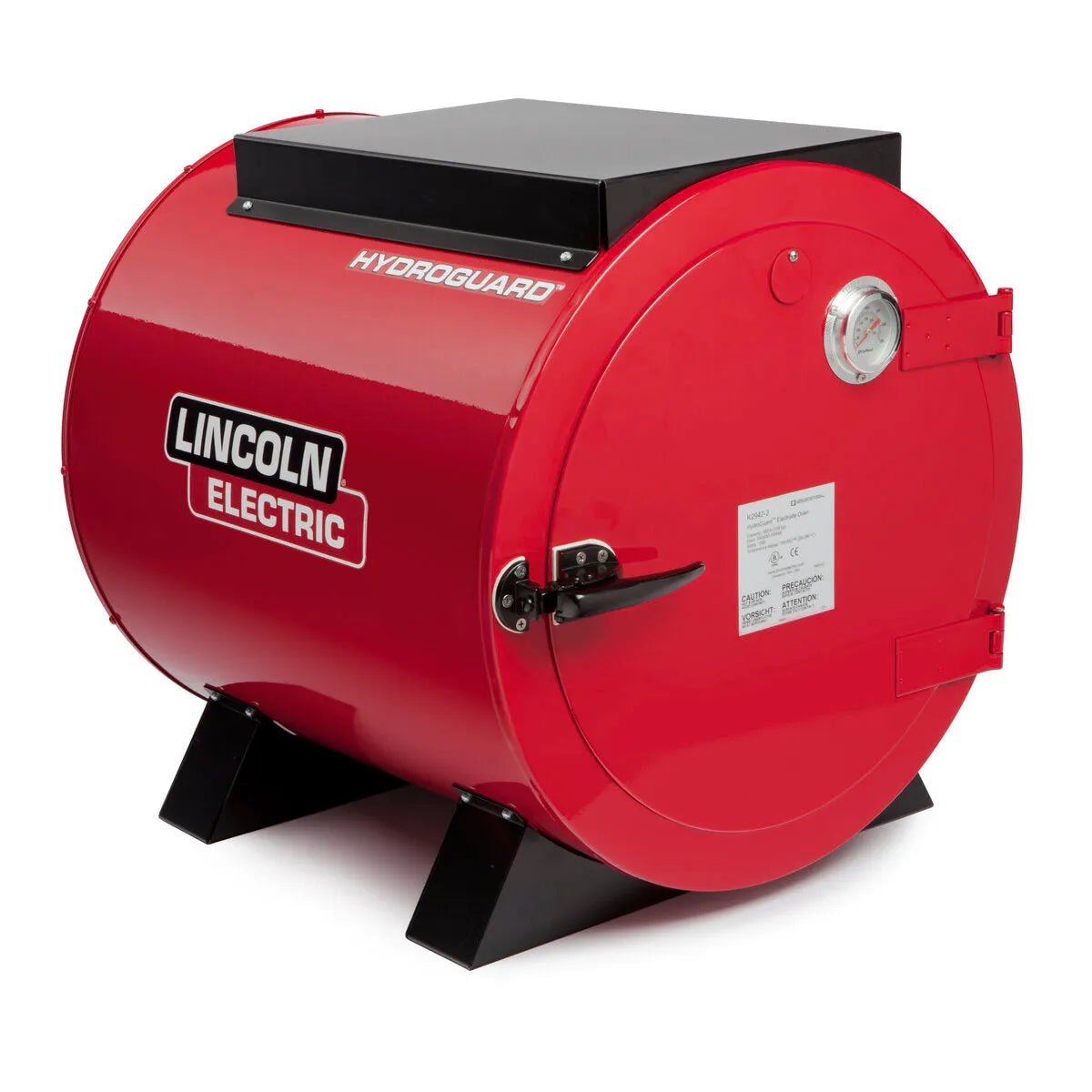 The Lincoln HydroGuard Bench Welding Rod Oven 115/120 V K2942-1 is a large red cylindrical oven with black legs, a side handle, gauge, hinged black lid, and visible logo. Ideal for industrial stick electrode storage and moisture resistance.