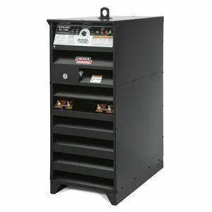 The black Lincoln IDEALARC DC-1500 Multi-Process Welder (K1383-4 Export Only) has a top control panel with gauges, switches, and labels, open horizontal vents below, and a sturdy rectangular build with a metal lifting handle.