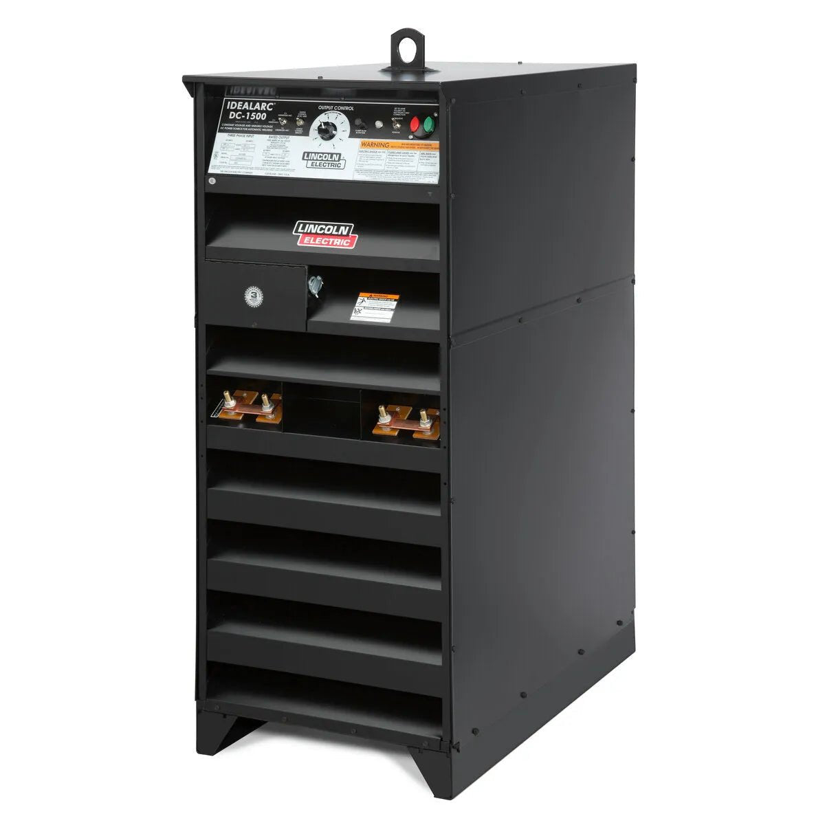 A large, black Lincoln Idealarc DC-1500 Submerged Arc Welder - K1275 rests on the floor, featuring a front panel with dials, gauges, and switches for precise automatic welding, plus copper connectors and air vents near the base.