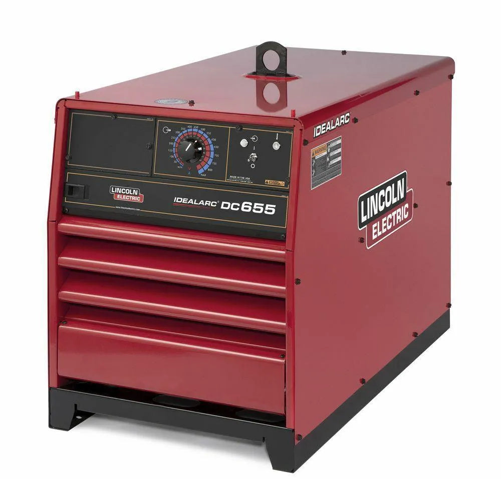 A red Lincoln IDEALARC DC-655 - K1609-2 industrial welder, ideal for heavy-duty shops, features a front control panel with dial and switches, lower vents, a top carrying ring, and visible branding/model on front and side panels.