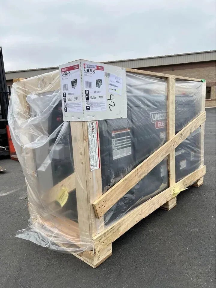 Lincoln Maverick 325X Kubota Engine Welder/Generator (K3581-1) crated, wrapped for shipping at WeldingMart, outdoor setting.