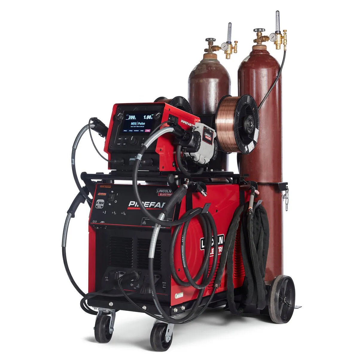 A Lincoln PIPEFAB Ready-Pak (K3734-1) welding system in red, complete with cables, hoses, and controls on wheels. Two tall brown gas cylinders are strapped at the back—ideal for pipe and vessel fabrication jobs.