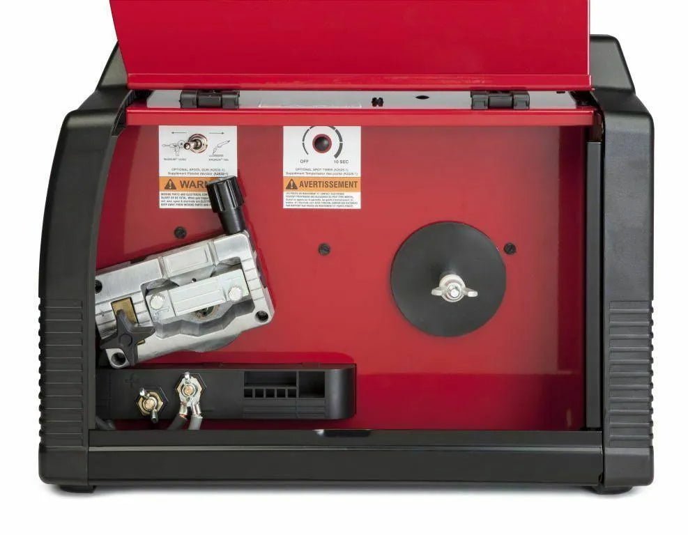 Lincoln Power MIG 180 Dual MIG Welder with open cover showing wire feed, red interior, spool holder, and controls—WeldingMart tools.