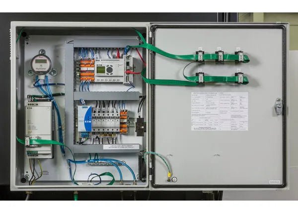 The Lincoln Prism Central System 5 HP (2750 CFM) 4 Vertical Filter Fume Extraction Unit AD1326-17 features an open gray control panel with organized wiring, breakers, terminal blocks, a meter, main controller, grounding straps, and a door schematic.