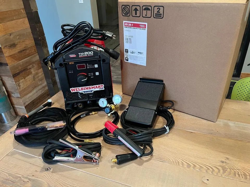 Lincoln SquareWave TIG 200 TIG Welder with accessories displayed on table next to WeldingMart box โ welding equipment for sale.