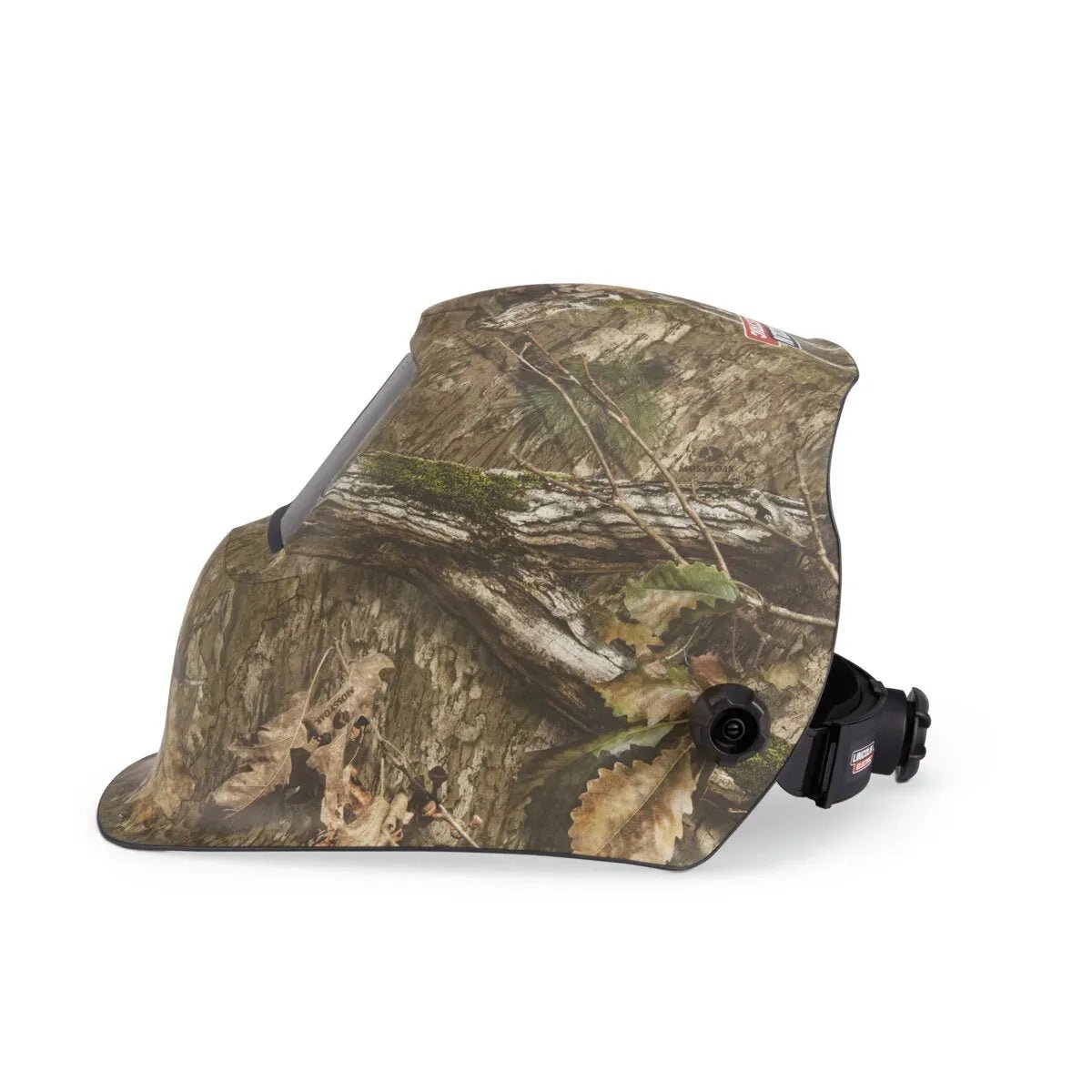 The Lincoln VIKING 1740 Mossy Oak Country DNA Welding Helmet (K5241-3) features a tree bark and leaf camouflage pattern, a rectangular auto-darkening lens, and an adjustable black headband with a knob, shown from the side.