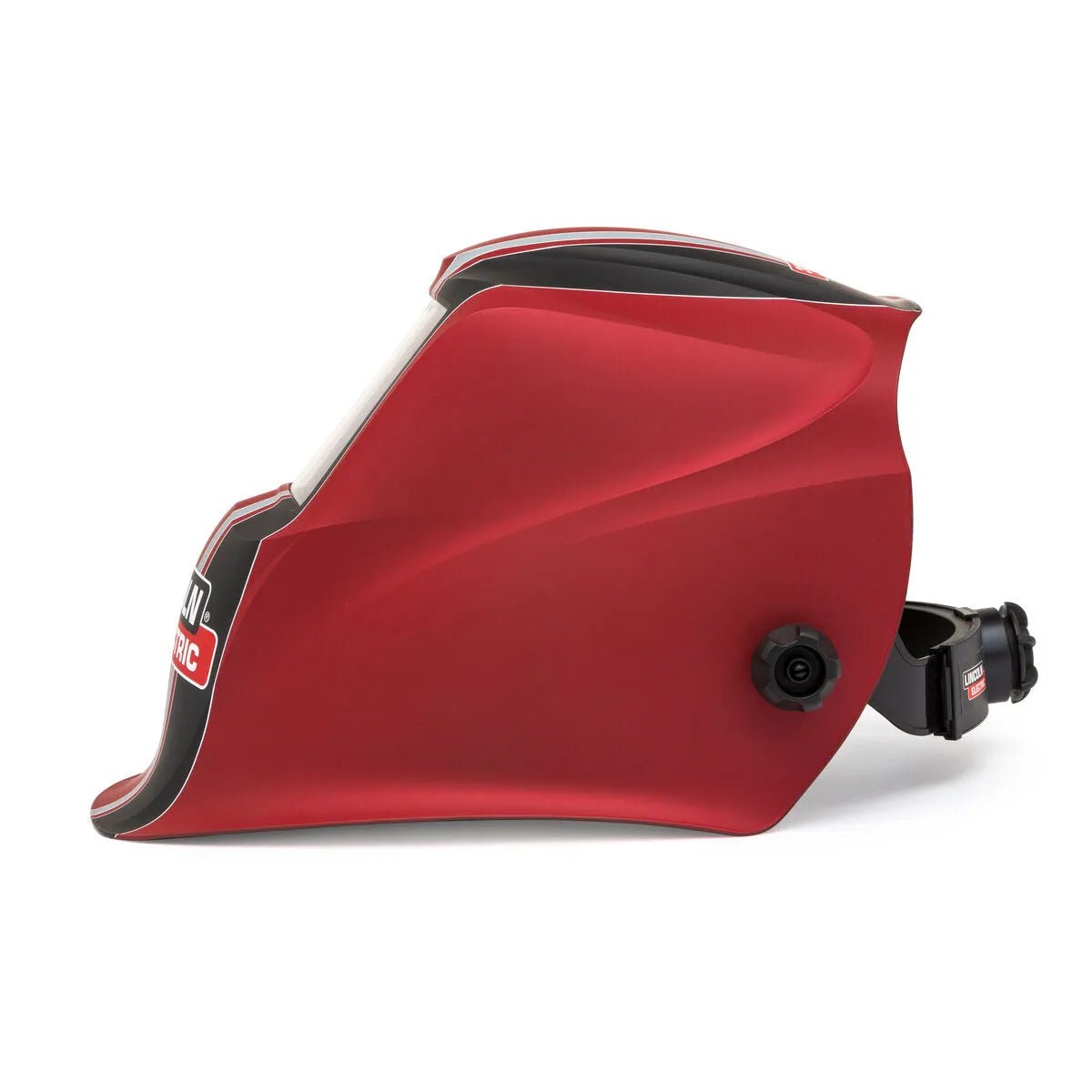 A side view of the Lincoln VIKING 1740 ReCode Welding Helmet K3495-3 shows its red, curved shell, black adjustable headband, large clear face shield, a small black adjustment knob, and partially visible branding near the front.