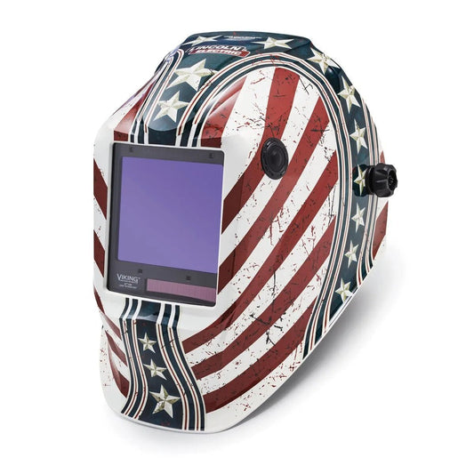 The Lincoln VIKING 3350 Daredevil Welding Helmet (K3683-4) features a distressed American flag design, a large auto-darkening viewing window with 4C Lens Technology, and side adjustment knobs for convenience.