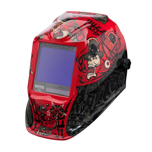 The Lincoln VIKING 3350 Mojo Welding Helmet (K3101-4) features a red and black shell, large viewing window, auto-darkening lens, bold graphics with skulls and gears, โVikingโ branding on the front, and an easy side knob adjustment.