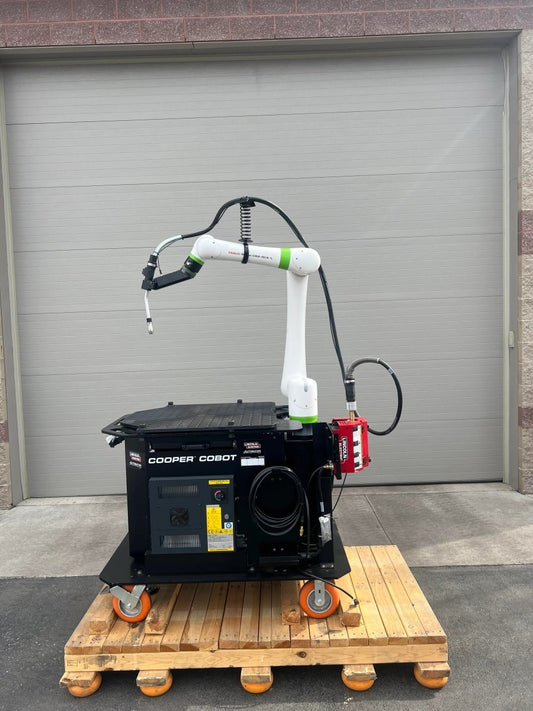 Lincoln Cooper CRX-10iA/L Air-Cooled Welding Cobot Cart (AD2489-8) on pallet, top welding automation equipment by garage door.