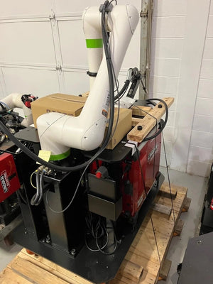 Lincoln Cooper CRX-10iA/L Air-Cooled Welding Cobot Cart on red base, cables attached, workshop pallet—WeldingMart equipment.