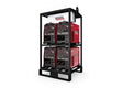 Four Lincoln Flextec® 650X welders are stacked two per level in the black K3510-1 4-Pack Rack, displaying front-panel dials and switches against a plain white background.