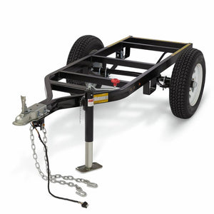 The Lincoln Compact Medium Welding Trailer K5270-1, a black metal frame with Duo-Hitch, two large tires, towing hitch, support stand, safety chains, and wiring connector, is displayed on a plain white background.