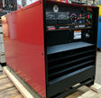 Lincoln Idealarc DC-1000 Subarc Welder U1386-3 on pallet in workshop, with dials and gauges—industrial welding equipment.