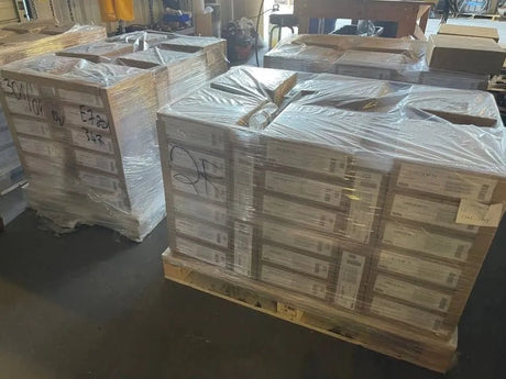 Lincoln 71 T1 1/16" welding wire spools, 33lb each, 50-pack on pallets, shrink-wrapped, ready for shipment in warehouse.