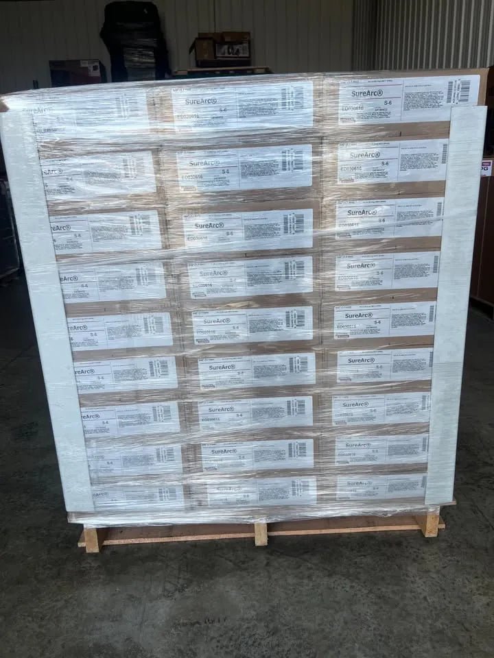 Pallet with 81 rolls of Lincoln ED033272 SureArc S6 .052 MIG welding wire, 33lb spools, shrink-wrapped for WeldingMart.