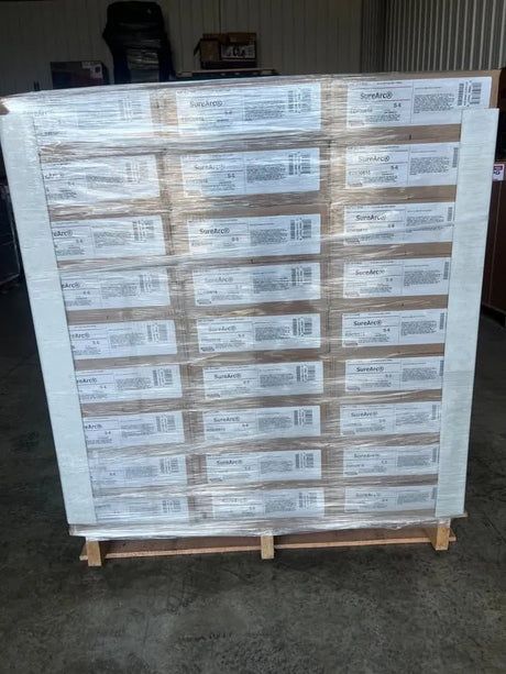 Pallet with 81 rolls of Lincoln ED033272 SureArc S6 .052 MIG welding wire, 33lb spools, shrink-wrapped for WeldingMart.