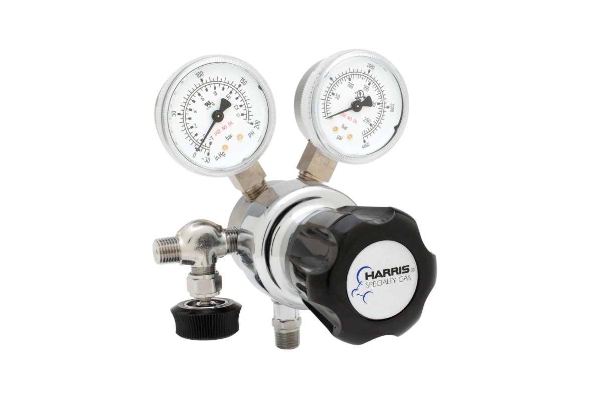 The Harris - 701-125-000-A High Purity Regulator (701125000A) is a single-stage cylinder regulator with dual gauges, metal fittings, and a black HARRIS Specialty Gas knob, shown on a white background for laboratory use.