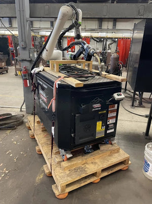 Lincoln Cooper CRX-10iA/L Welding Cobot Cart (AD2489-14) on a welding machine in a workshop with tools and safety barriers.