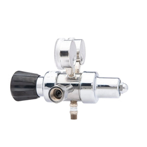 The Harris HP702-050-320-BE Carbon Dioxide Regulator, featuring dual pressure gauges, a black left adjustment knob, and a lower threaded connector, is photographed against a white background.