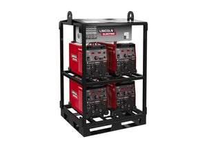 The Lincoln K4726-2 Flextec 350X PowerConnect 4-Pack Rack is a black metal modular rack holding four red welders, stacked two per shelf with control panels forward, and includes top lifting eyes for easy transport on a plain white background.