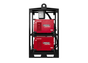 A Lincoln K4726-2 Flextec 350X PowerConnect 4-Pack Rack, in black metal, holds two red welding machines stacked vertically with vents, white branding, thick black cables, and a top lifting eye for compact modular welding.