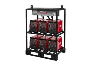 A black welding rack holds six red Lincoln Flextec 350X PowerConnect machines (K4727-2), three per shelf, with visible power cables and controls. A power distribution box sits on top of this multi-operator welding solution.