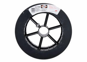 A black plastic spool with a central hole holds Harris 308L Stainless Steel MIG Welding Alloy - 0308L18 wire. From above, a white and red label with brand details and alloy specs appears on a clean white background.