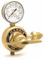 A brass Harris high pressure cylinder regulator with a pressure gauge displaying readings in psi and kPa, and a control valve lever. The gauge is marked for use with argon and features safety warnings.