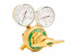 A brass Harris High-Pressure Oxygen Regulator with two gauges and a green label, designed for controlling and monitoring gas flow in high-flow cylinder applications. The front gauge shows delivery pressure; the top displays tank pressure.