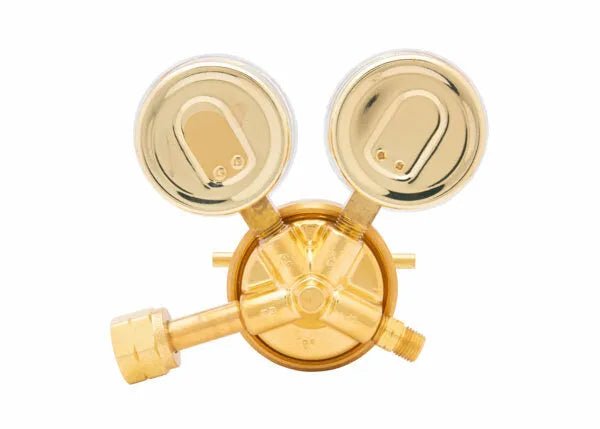 A brass industrial gas regulator with two circular pressure gauges and three connecting ports, ideal as a single stage regulator for methane or hydrogen, displayed against a white background.