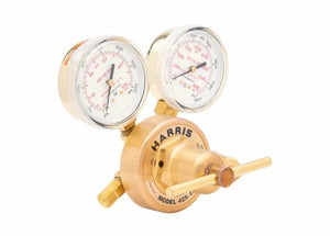A brass single-stage industrial regulator with two pressure gauges and a control knob, labeled Harris 425 Argon regulator, photographed on a white background.