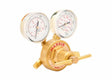 A brass single stage regulator with two pressure gauges displaying measurements, labeled HARRIS on the front. This industrial gas regulator features a control knob and connectors for attaching to gas cylinders.